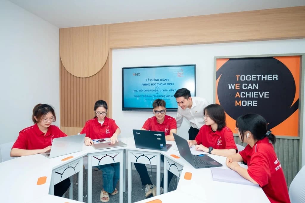 Students working at laptops in a smart classroom at the Institute.